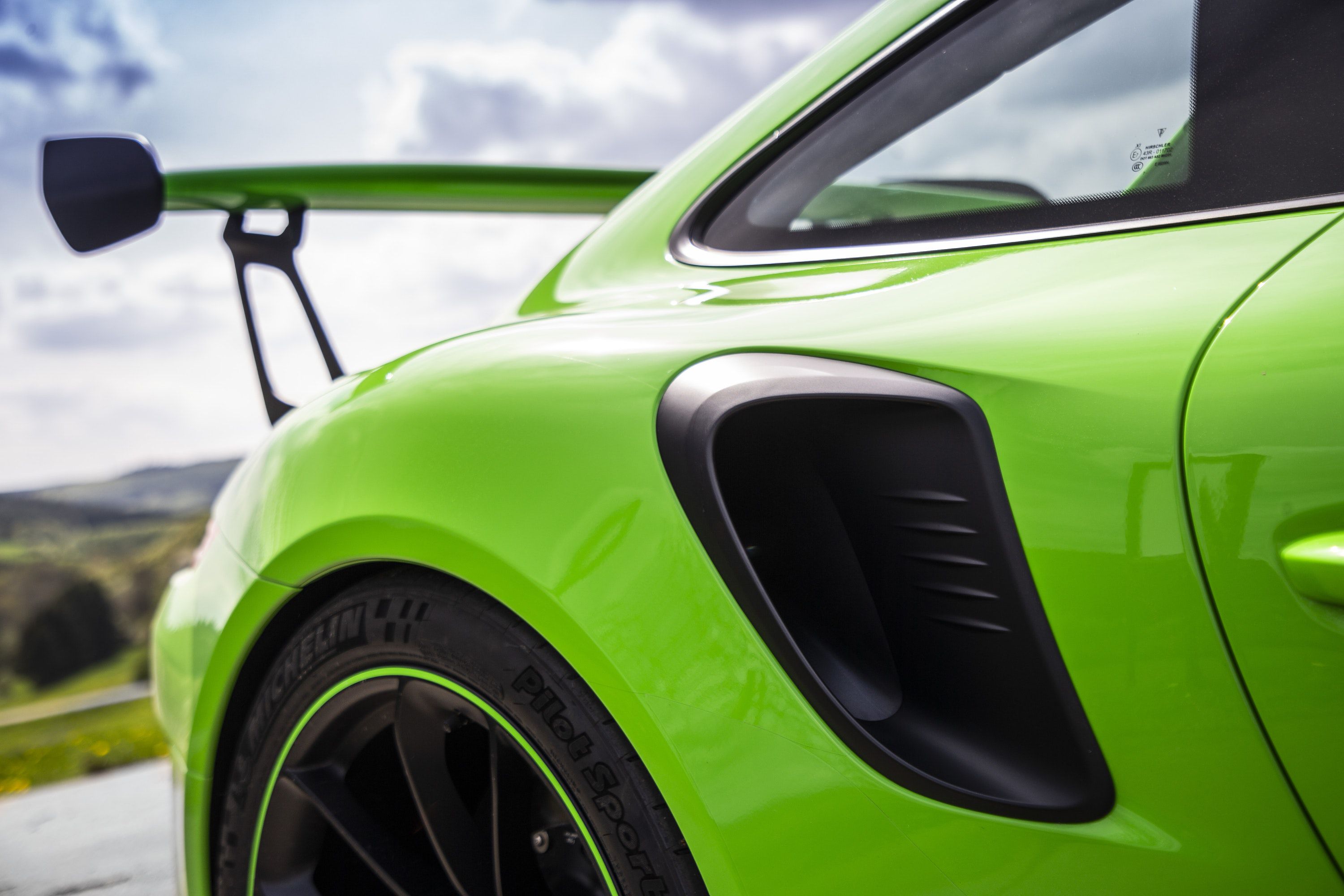 close up of the rear end of a green Porsche 911 GT3RS